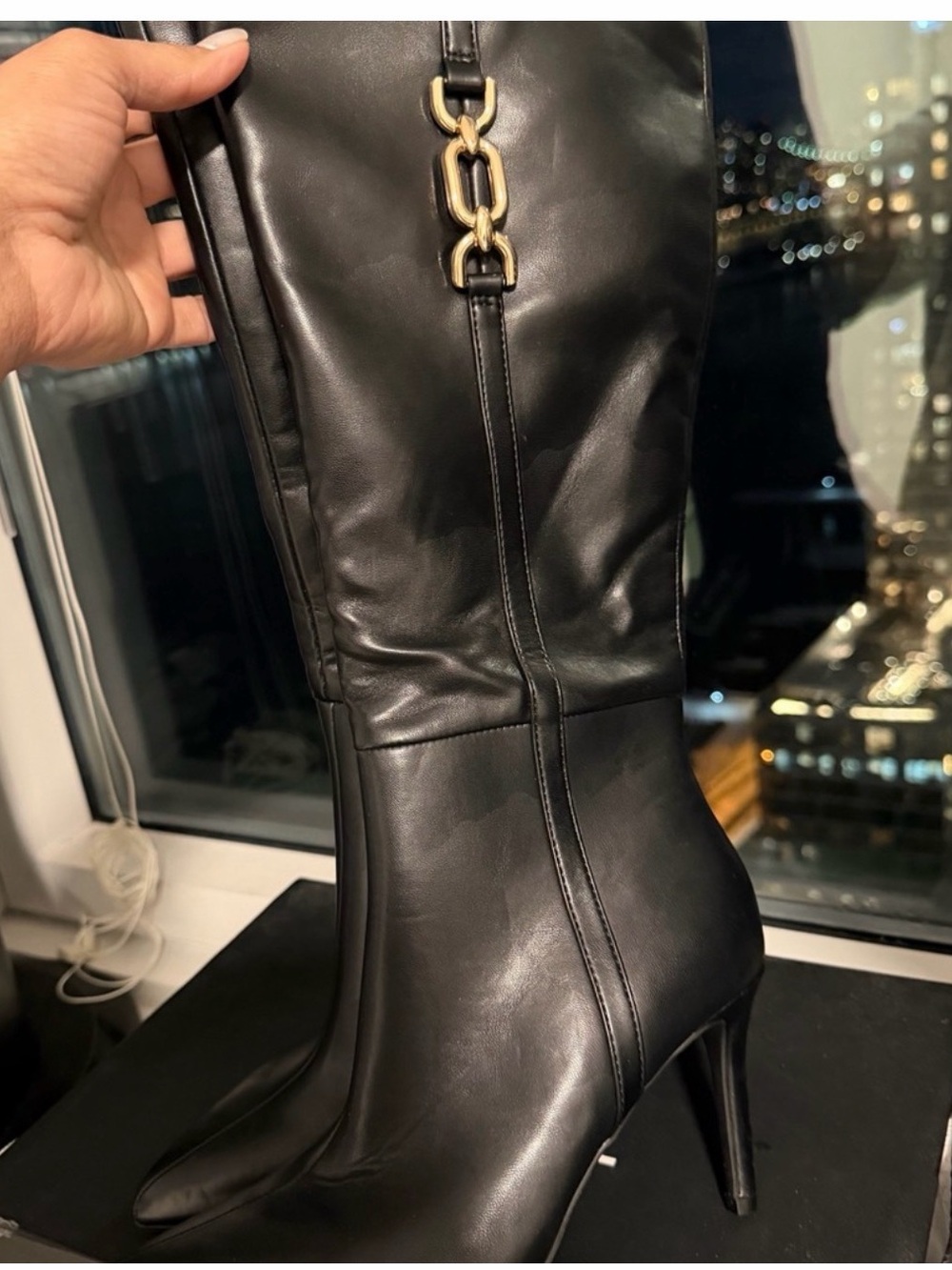 BCBG Black Leather Knee-High Stiletto Boots with Gold Chain Accent